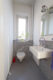 Blömker! Ein Zuhause zum Ankommen: Großzügiges Familienhaus mit Garten, Garage & Dachterrasse - Gäste WC